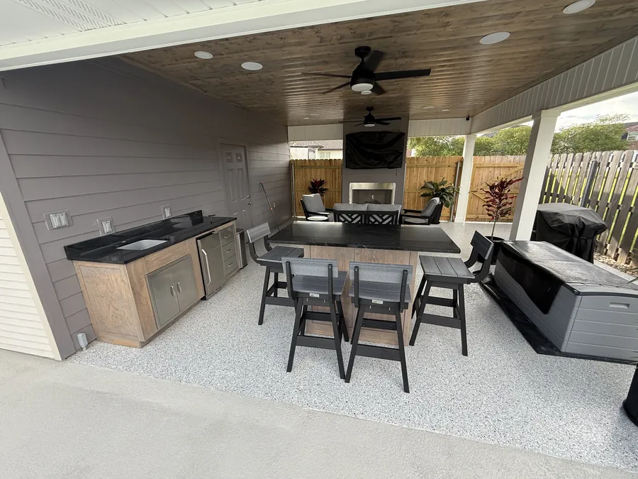 Outdoor kitchen and covered patio finished with a flake concrete coating