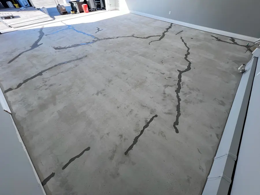 Cracked garage slab before repair