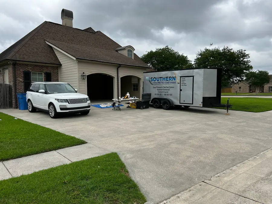 Crew trailer staged at a home before a garage floor job