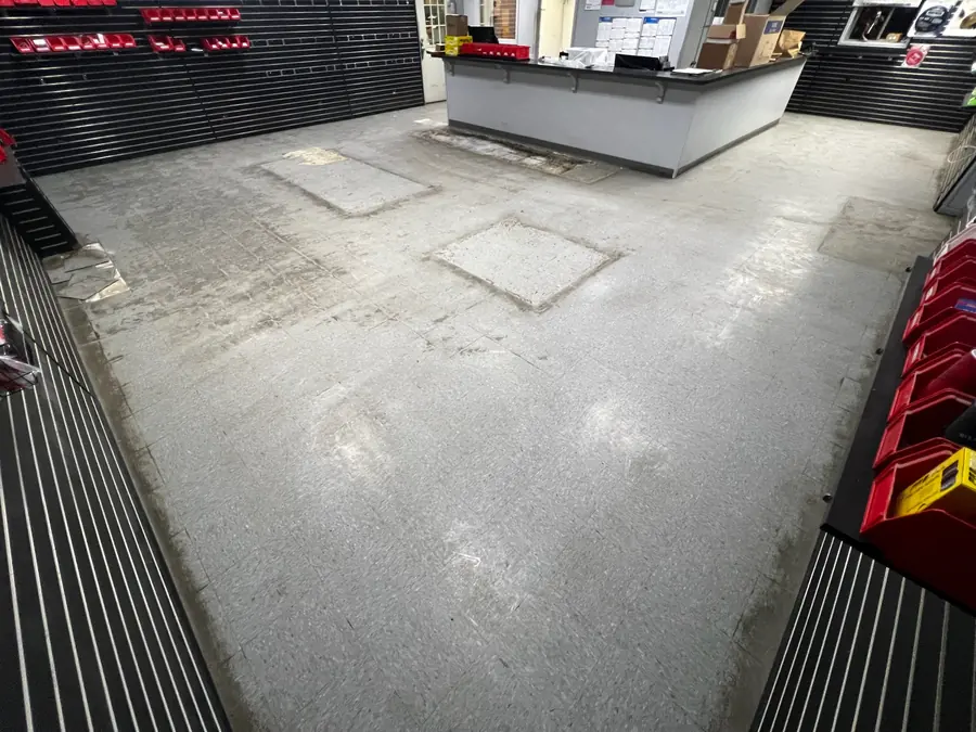 Showroom slab ground down to bare concrete before coating