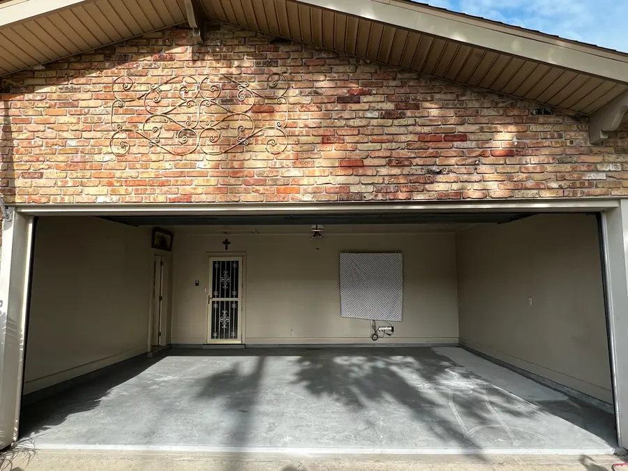 Brick-front garage before its floor coating