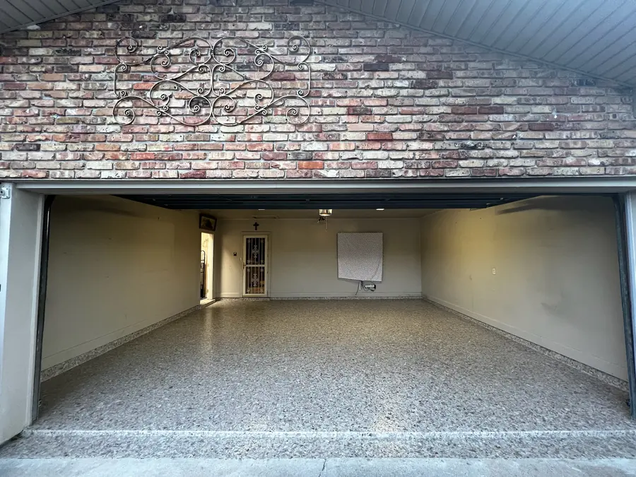 Brick-front garage with a new flake floor