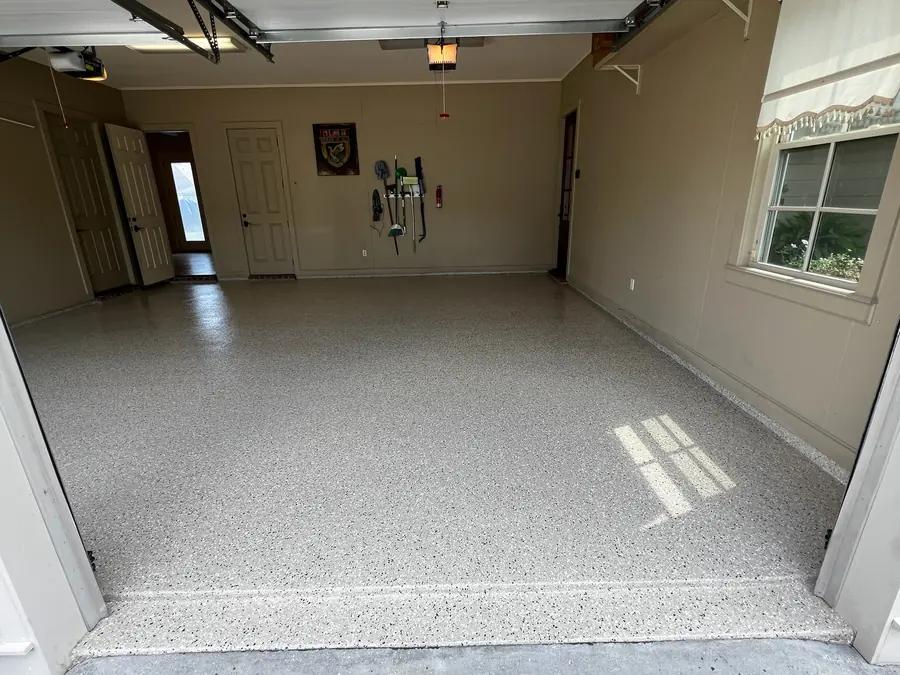 Light grey flake finish in a tan-walled two-car garage