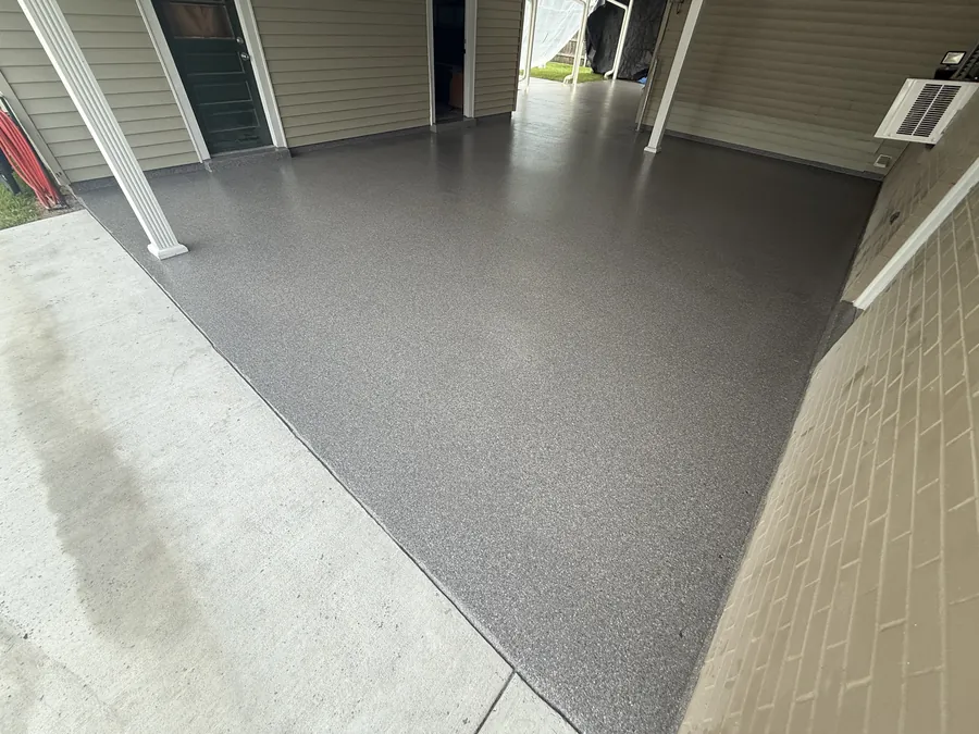 Grey flake coating on a residential carport slab