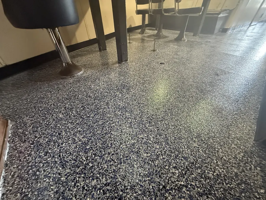 Flake flooring under the mess tables aboard a supply vessel