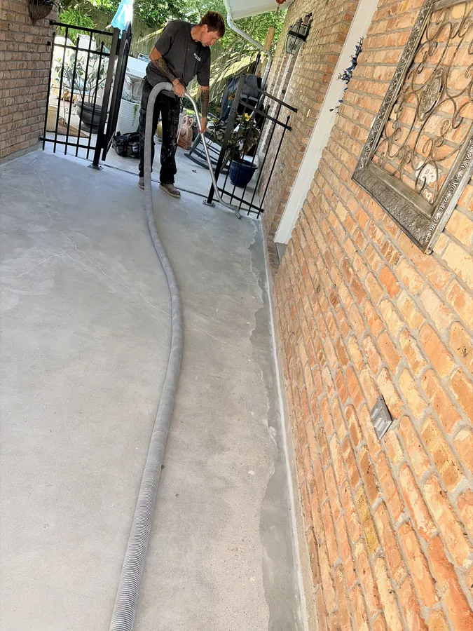 Prepping a residential walkway slab for crack repair