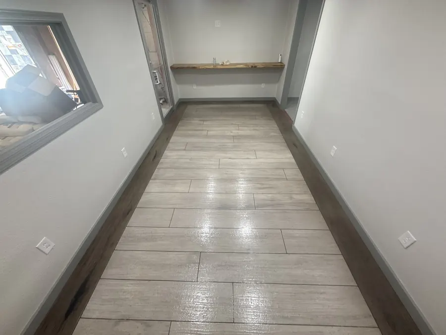 Microcement wood plank overlay with a dark plank border