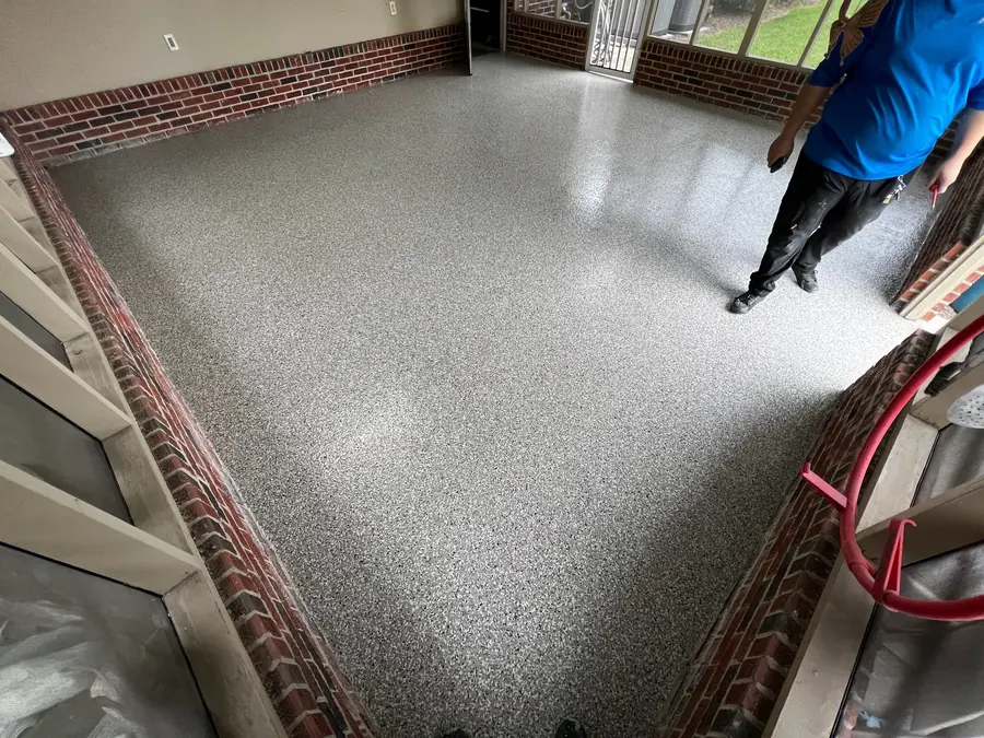 Finished flake floor on a brick-walled porch