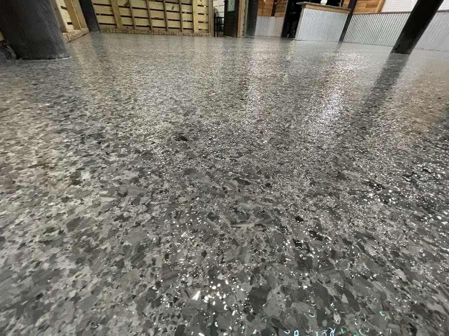 Close-up of the grey and black flake texture on a camp floor
