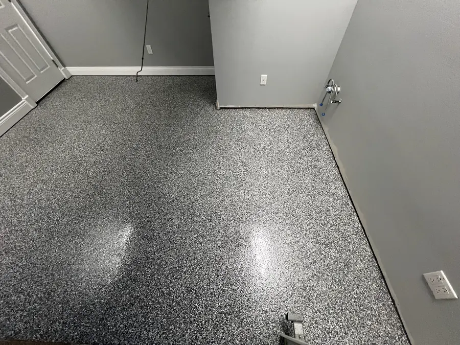 Grey flake floor in a finished garage room